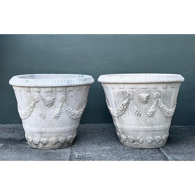 This pair of monumental cast concrete planters captures the stately elegance of Neoclassical garden design. Expertly...