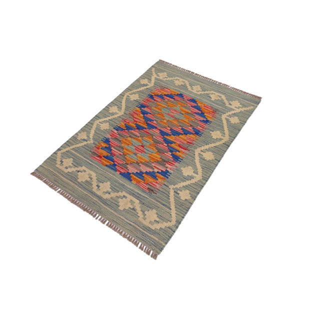 Elevate the elegance of your home with this stunning hand-woven tribal Kilim wool rug. Meticulously crafted on a loom by...