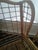 Rare find. Chippendale influence Rattan Wingback chair with matching ottoman. Lovely arm detail arched upper back and...