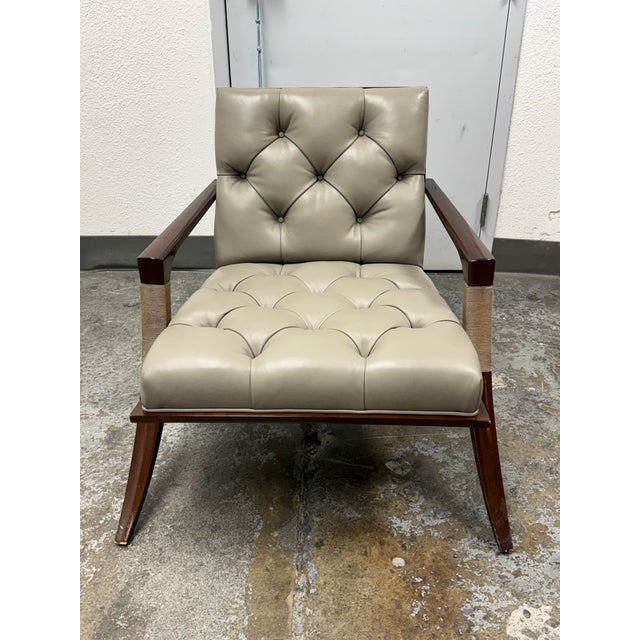 Design Plus Gallery presents the Athena Armchair designed by Thomas Pheasant for Baker Furniture. Taupe leather upholstery...
