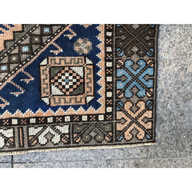 This is a vintage Turkish Oushak rug from the 1960s. The piece was hand-knotted.