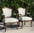 A handsome pair of antique Louis XV style bergère armchairs crafted in richly figured walnut with elegant cabriole legs,...