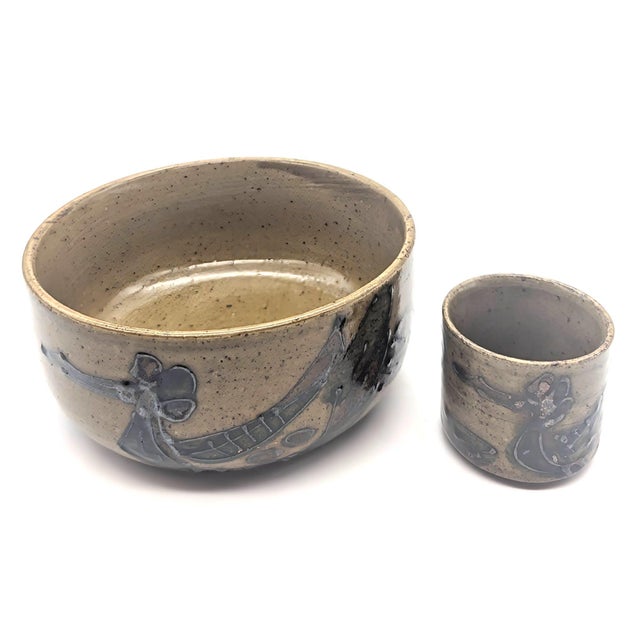 Offered are vintage 1970s Japanese glazed stoneware pieces, a serving bowl and a sake or tea cup, made by Otagiri...