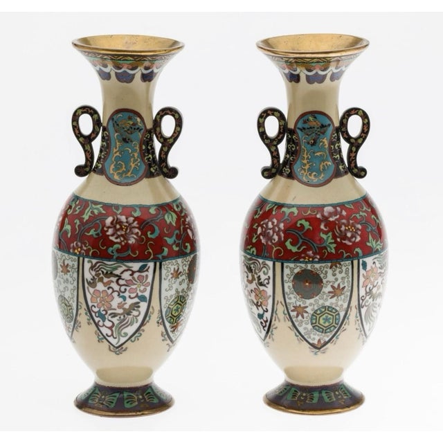 A decorative pair of Japanese cloisonné enamel vases dating to the Meiji period, each measuring approximately 9 inches in...