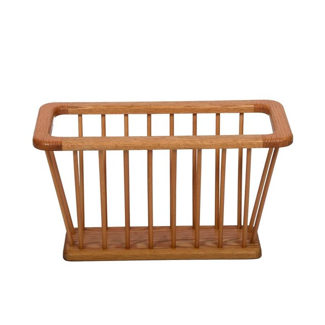 Mid-Century Modern Danish oak magazine rack. This fantastic item was produced in Italy during the 1970s. A wonderful piece...
