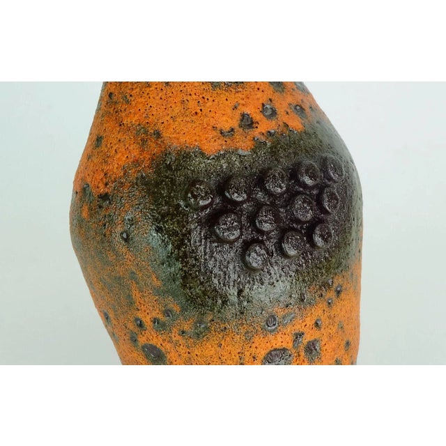 Rare Mid Century Vase from Ü-Keramik (Uebelacker) from the 1960s. Model 'Robot' with fat lava glaze in orange and dark...