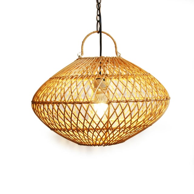 Beautifully handwoven rattan pendant light which brings a warm organic texture to any space while maintaining a light,...