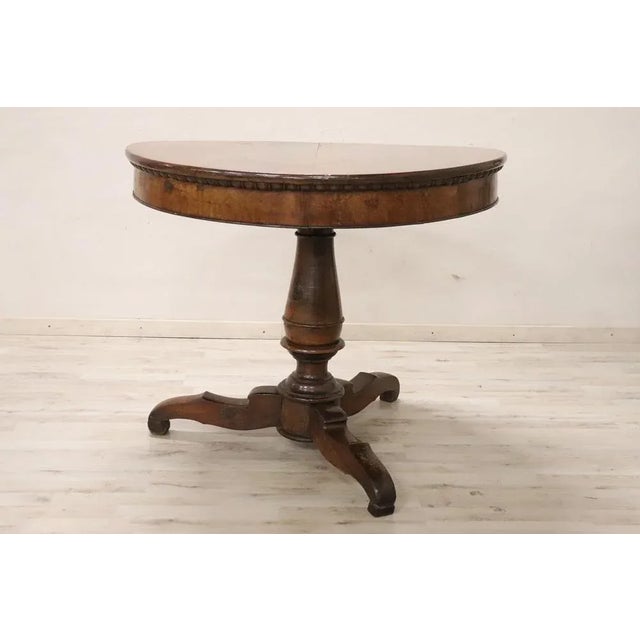 Beautiful important Charles X antique round center table, 1825. The large and solid central stem in turned walnut. The...