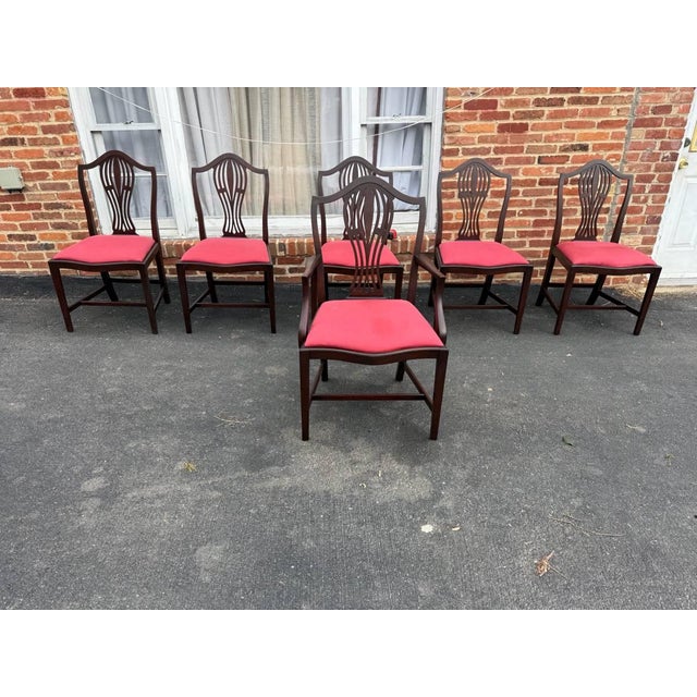 Set of 6 English Hepplewhite Style Dining Chairs. Circa early 20th century A shaped top, carved open splat to the centre,...
