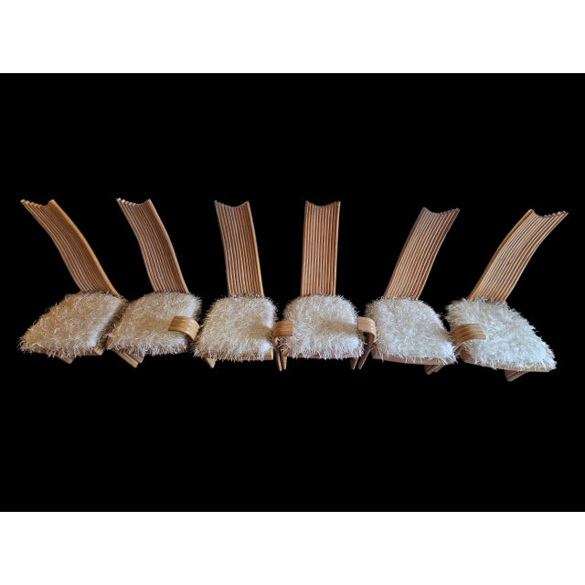 This charming set of six chairs consists of two captain's chairs and four high back strait rattan chairs. All seats have...