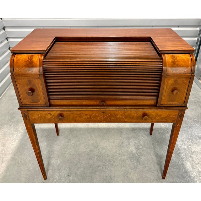 A finely crafted Federal Revival tambour writing desk by Charak Furniture Co., Boston, retaining its original paper label...