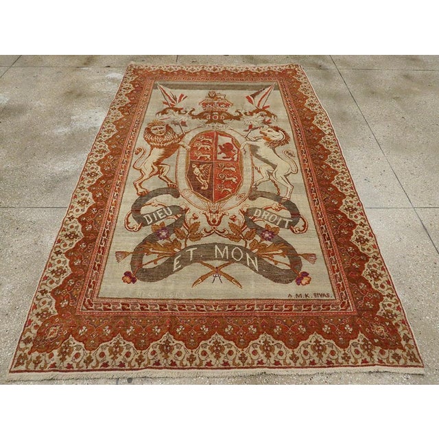 An antique Turkish Sivas accent rug handmade during the early 20th century with a pictorial design of the 'Royal Coat of...