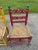 One of a kind vintage hand painted rush seat dining chairs, one yellow and one red. Intricate rush weaving on seats,...