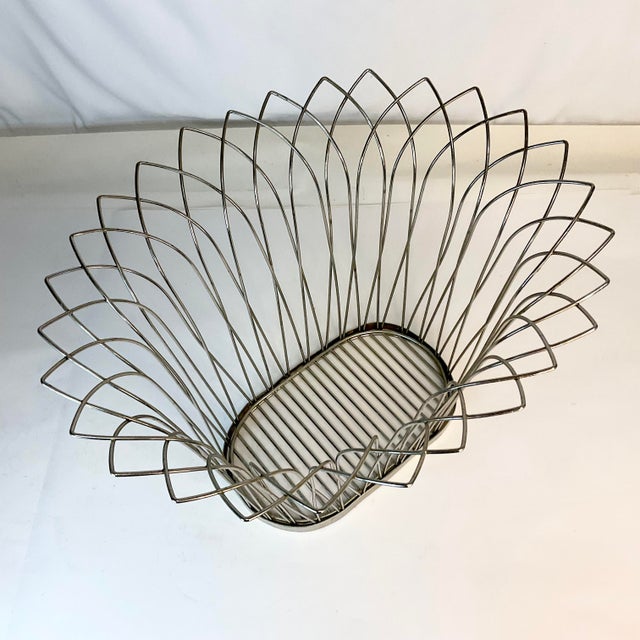 This is a great vintage wastebasket. The design has crown points crafted by wire along the oval shaped rim. It’s a chic...