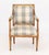 Louis XVI Style Walnut Arm Chair, with blue and white gingham upholstery. 34" H x 23" W x 19" D; seat: 18.5" H....