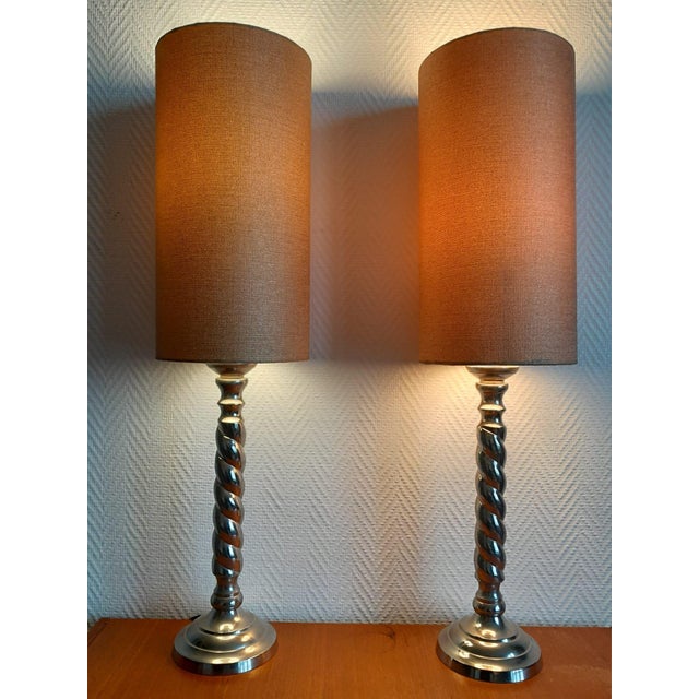 Pair of metal lamps circa 1970 Stunning, large lamp bases in the form of a twisted, silver-plated column, fitted with two...