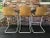 This rare set of three unique midcentury bent plywood bar stools would make a nice addition to any bar, whether in a...