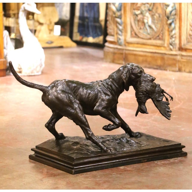 Striking in scale and full of movement, this late 19th century sporting sculpture depicts a hunting dog proudly carrying a...