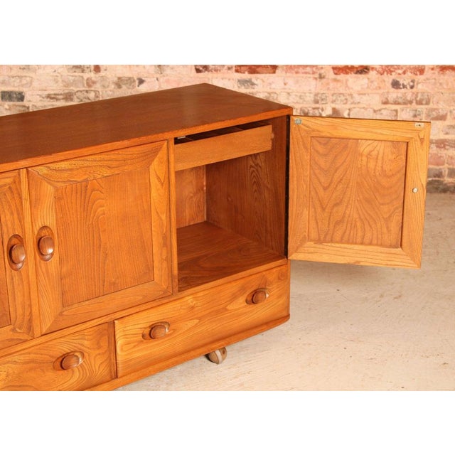 Wood Mid-Century Modern Windsor Elm Sideboard on Casters from Ercol, 1960s For Sale - Image 7 of 12