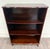 This is a beautiful vintage Queen Anne style mahogany bookshelf or bookcase featuring a rich mahogany finish, elegant...