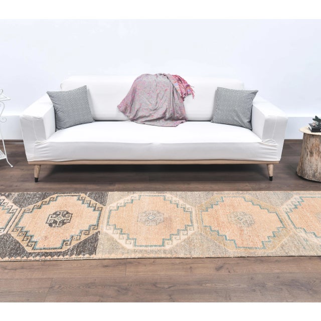 Vintage Turkish Hand-Knotted Coral Orange Runner Rug is a semi-Vintage rug. '60s Eastern region of Turkey's unique rug is...