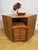A beautiful and highly practical vintage teak corner cabinet by nathan furniture, dating from the 1960s–1970s. Crafted in...