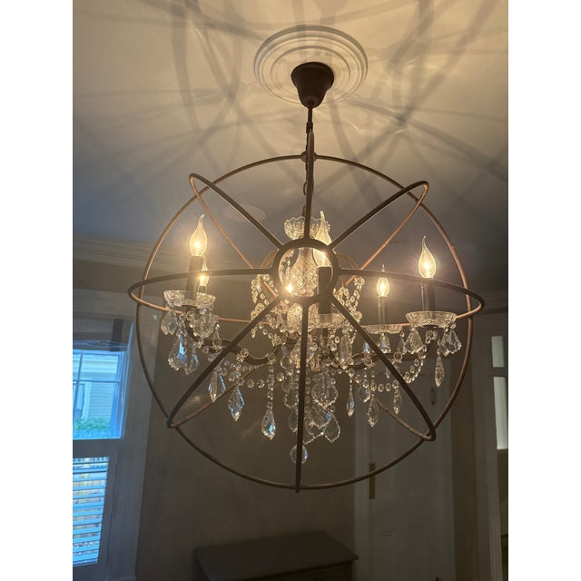 stunning 32-inch Foucault's Orb Crystal Chandelier. Designed by Timothy Oulton for Restoration Hardware, this iconic...