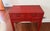 Striking vintage Chinese console table in a rich red lacquer finish with hand-painted gold detailing. Features two drawers...