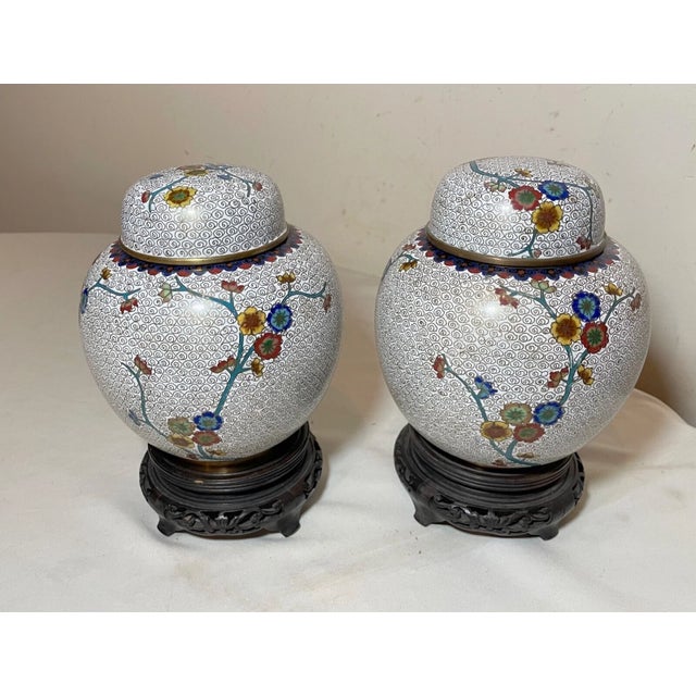 Up for sale is a very nice quality pair of antique handmade Chinese cloisonné ginger jars. They are done with very...