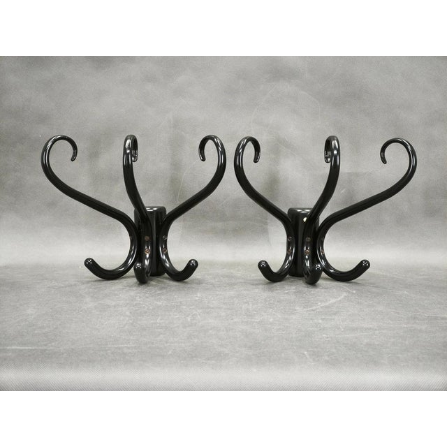 Pair of sculptural bentwood wall hooks produced in Czechoslovakia during the 1940s–1950s. Expertly crafted from bent beech...