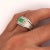 1.0-carat Colombian emerald and princess cut diamond men's ring in 18k solid gold. The natural emerald center stone bears...