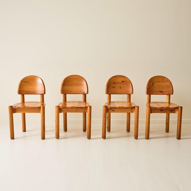 Set of four dining chairs by Rainer Daumiller, crafted in solid pine. Known for his organic, sculptural approach to...
