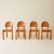 Set of four dining chairs by Rainer Daumiller, crafted in solid pine. Known for his organic, sculptural approach to...