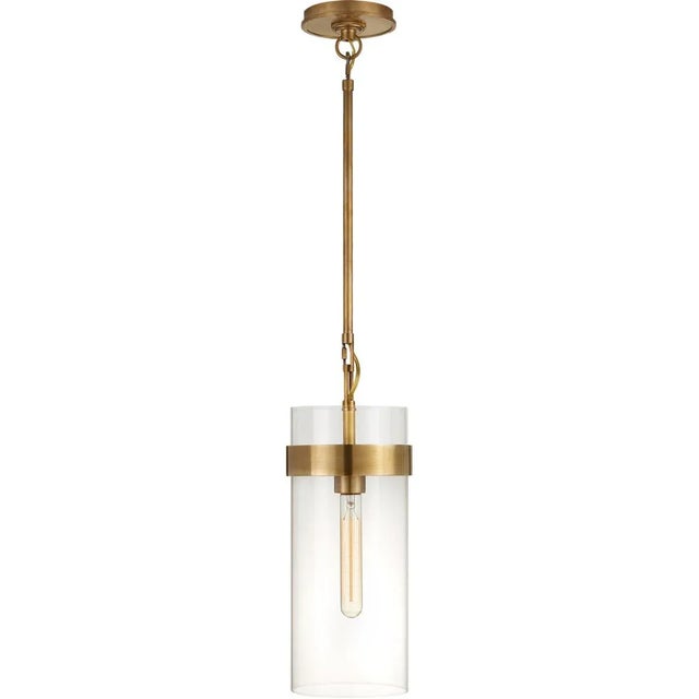 Presidio Small Pendant in Hand-Rubbed Antique Brass with Clear Glass Designer: Ian K. Fowler Fixture Height: 15.75" Min....
