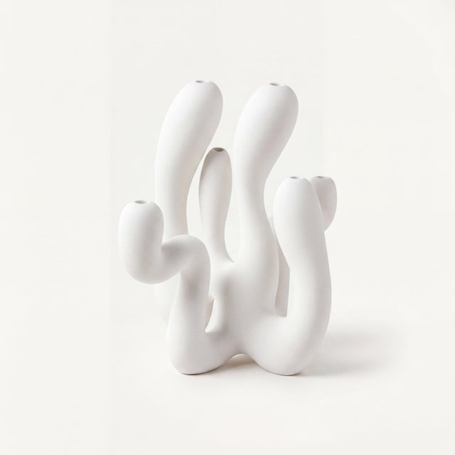 Includes: 6 taper candles, matchbox, glove set + signed COA An exploration of balance between strength and softness, Hold...