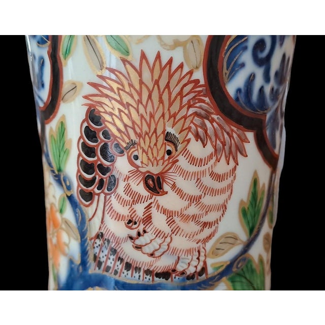 Pair of trumpet vases with floral and bird decorations in cobalt blue below deck, brick and gold above deck. Perfect state...