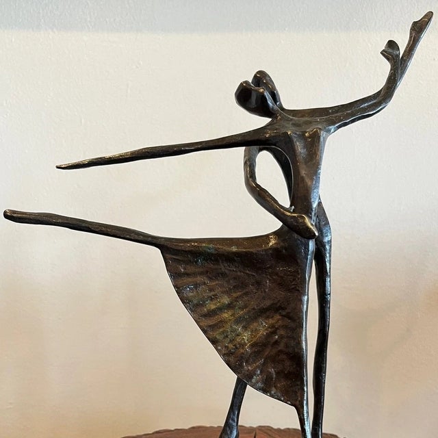 Presenting a striking vintage Mid-Century Modern abstract sculpture depicting two ballet dancers in a dynamic, fluid pose....
