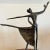Presenting a striking vintage Mid-Century Modern abstract sculpture depicting two ballet dancers in a dynamic, fluid pose....