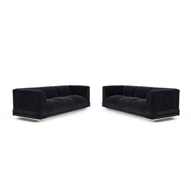 Pair of Jay Spectre sofas. Fully restored. Reupholstered in black mohair on polished chrome bases. Priced individually.