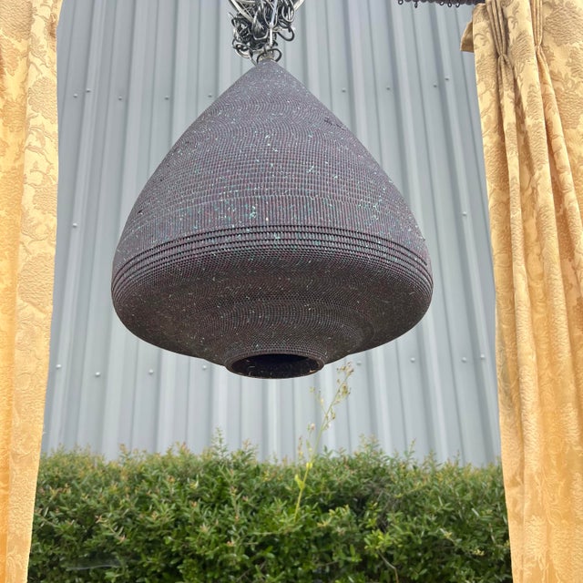 Rare and Large 1980’s mid-century modern style beehive pendant lamp in corrugated cardboard in a deep plum base color with...