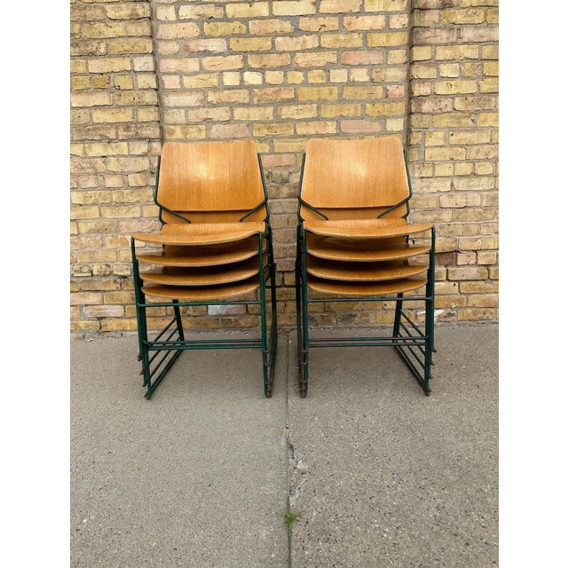 A matching set of 8 vintage German stackable school chairs. These are classic mid-century industrial chairs with molded...
