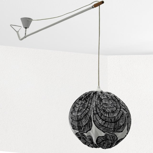 An industrial ceiling lamp produced by an unidentified Swedish manufacturer in the 1950s. Constructed from white-lacquered...