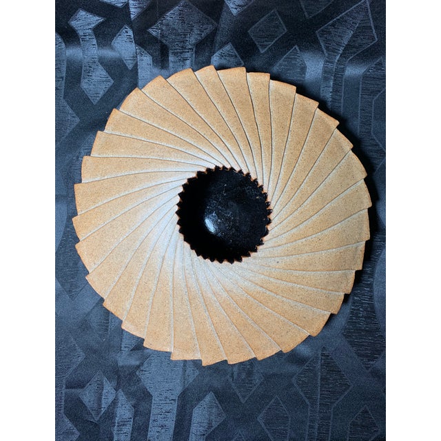 Offered is a large UFO shaped spiral pottery vase featuring exquisite hand sculpted details made from earth colored clay....