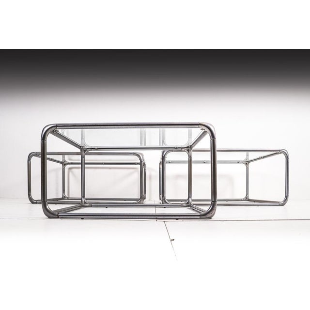 Rare design from the 1970s of the unusual kind. The glass plates rest on round hooks in the light metal frame in each...