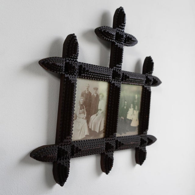ANTIQUE FOLK ART CARVED PHOTO FRAME Typically notched hand-crafted tramp art picture frame of unusual form. Charming...