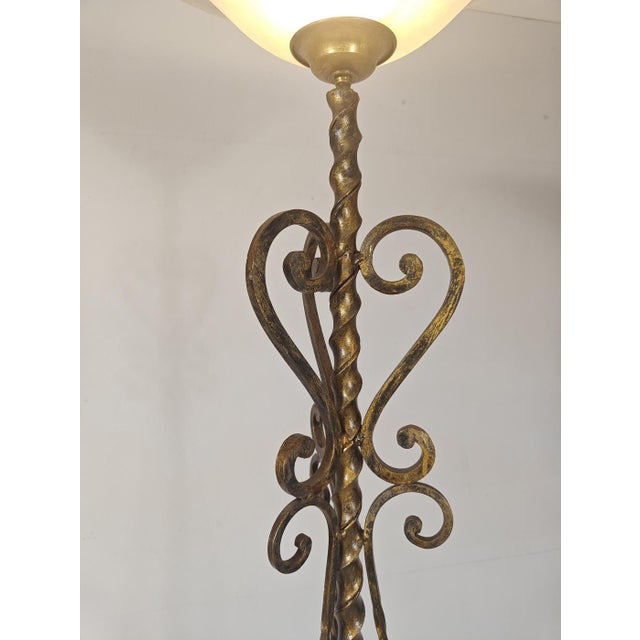 Add a touch of dramatic elegance to your space with this Art Deco torchiere floor lamp. Hand-forged from heavy wrought...