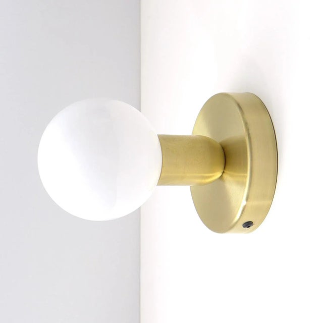 This pair of minimalist sconces is handmade of brushed brass. They can also be hung on the ceiling and are ideally suited...