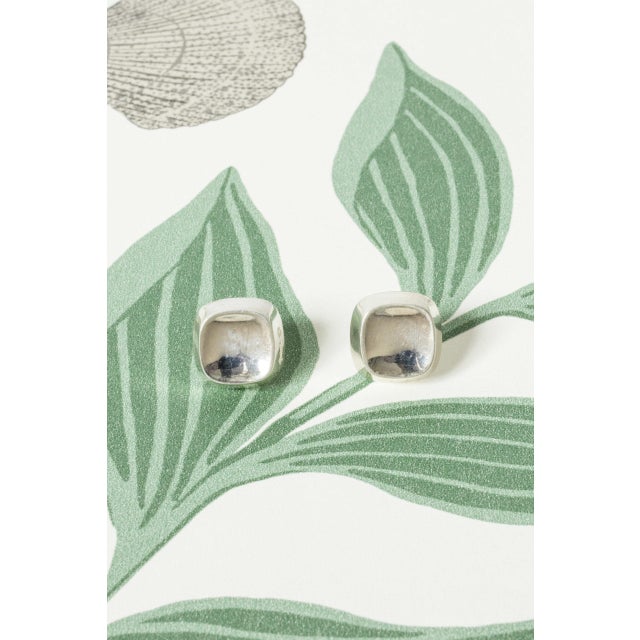 Pair of elegant silver earrings by Sigurd Persson, in the classic “Squares” design. Sleek, concave form perfect for...