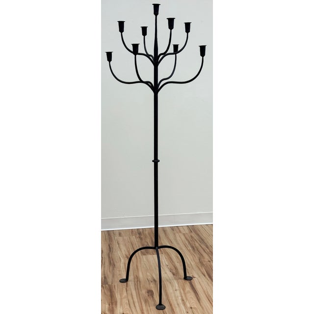 Vintage wrought Iron candelabra stand with tripod base. Accommodates nine (9) candles. Very decorative and functional...