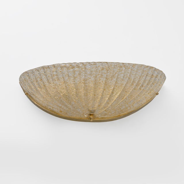 Pair of Barovier & Toso Mid-Century Modern shell sconces, made in Italy in Murano in clear and gold fluted Murano glass...